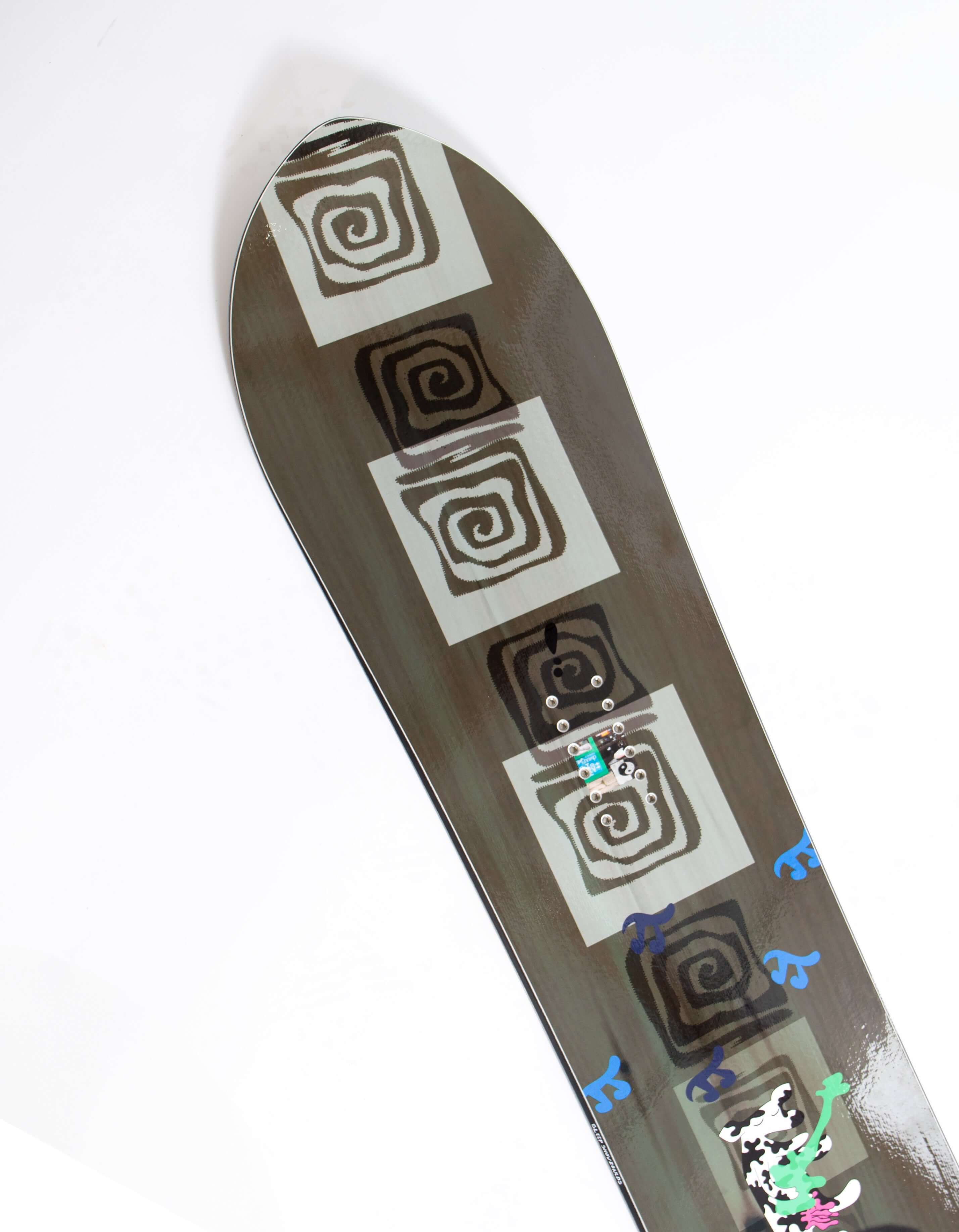 Top detail of Sleep Humble Pi Snowboard 159 with geometric patterns and colorful accents.